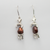 Red pearl and silver monster earrings